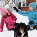 Six-year-old Jaylee Oeschger, 6, laughs as she is hit in the head with a snowball thrown by her sister Ileana, 10, as they play in the snow with their dog Mavis on Wednesday, Feb. 27, 2013.  Melanie Maxwell I AnnArbor.com